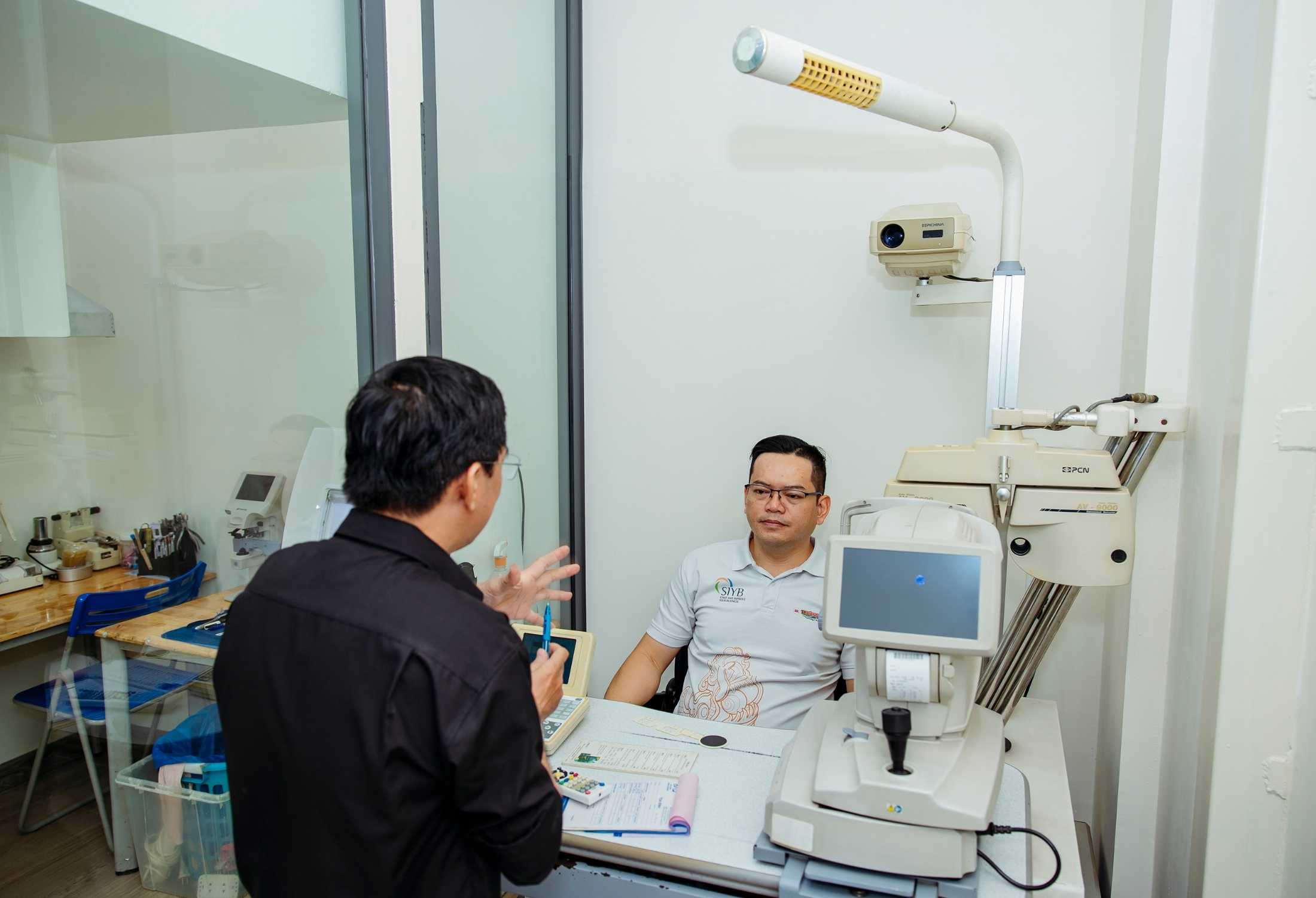 Tourist getting optical help at Nam Quang Optical in District 1